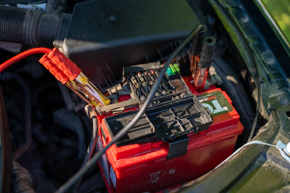 Car battery with jumper cables